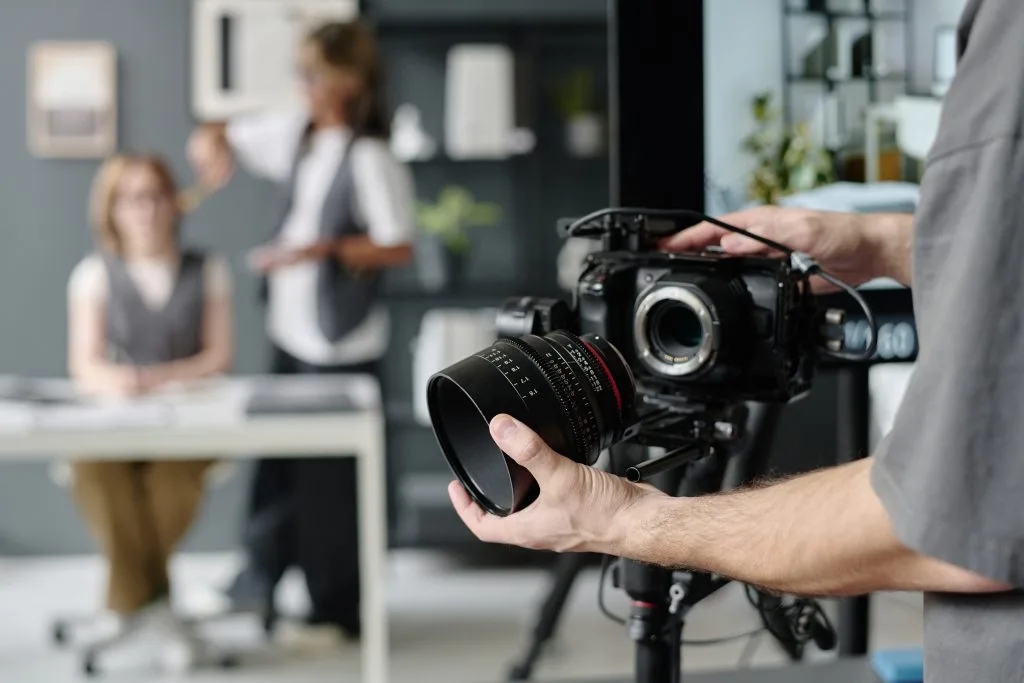 Nikon camera with lens, ready for professional photography, placed on a tripod or held for a shoot.
